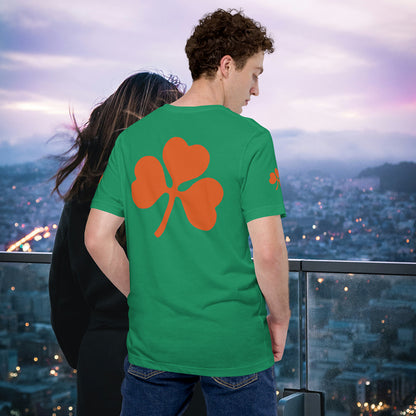 Back view of a green unisex T-shirt with a large orange clover design.