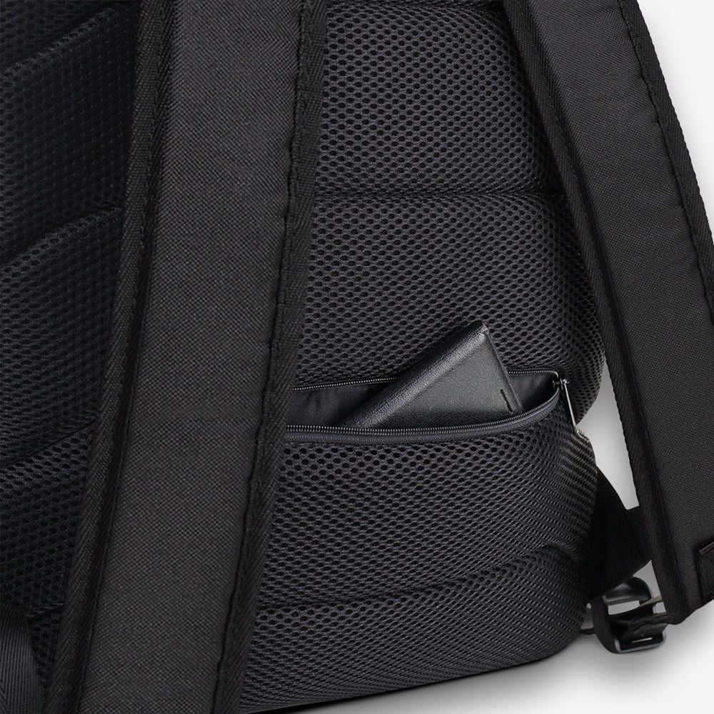 Detailed view of the backpack’s zipper area with a focus on the vibrant, geometric patterned trim.