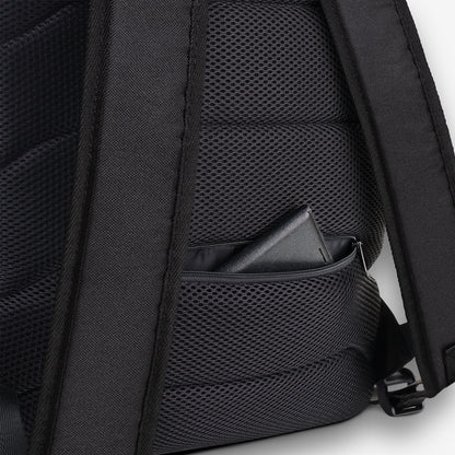 Mesh back padding detail on a backpack with black-and-white geometric pattern accents.