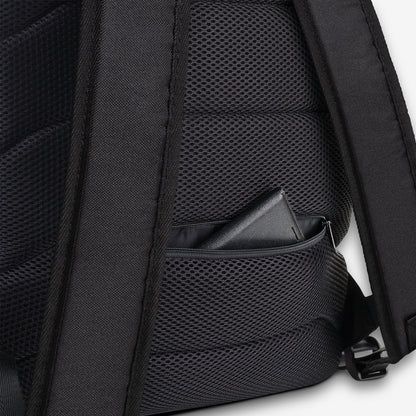 Zoomed-in view highlighting the backpack's external zip pocket on a mesh padded back panel, offering convenience and comfort.