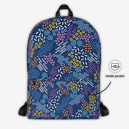 Frontal view of a backpack with a colorful abstract geometric pattern and a front storage compartment.