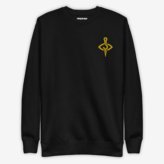 Full front view of a black sweatshirt with a craft-inspired golden yellow embroidery