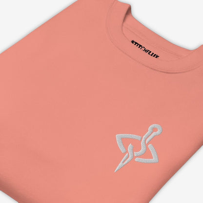 Detailed view of dusty rose sweatshirt with dark needle and thread design