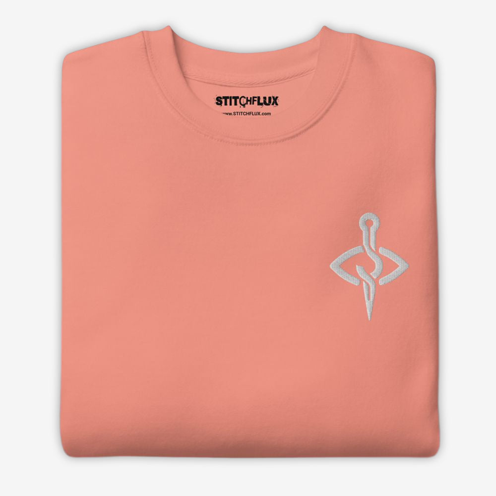 Dusty rose sweatshirt folded neatly with contrasting needle and thread icon