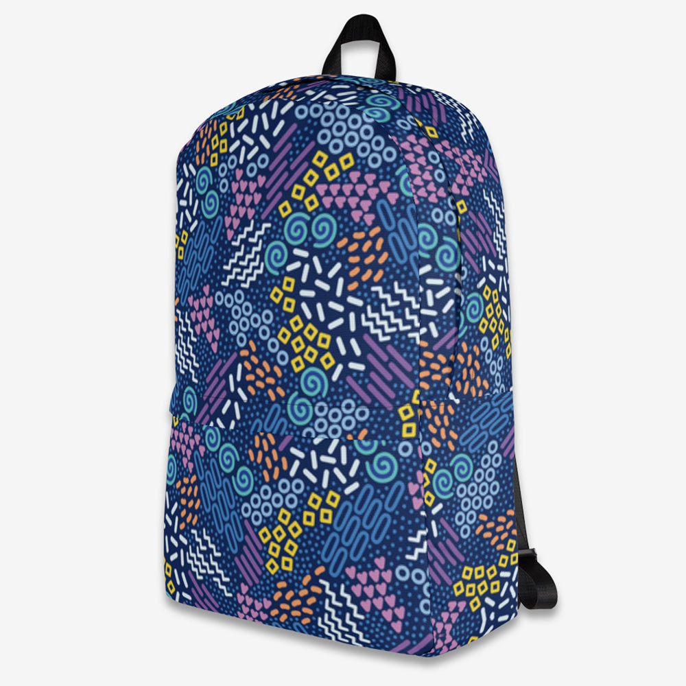 Side view of a backpack with continuous abstract geometric print along the side pocket, showcasing the vivid color scheme.