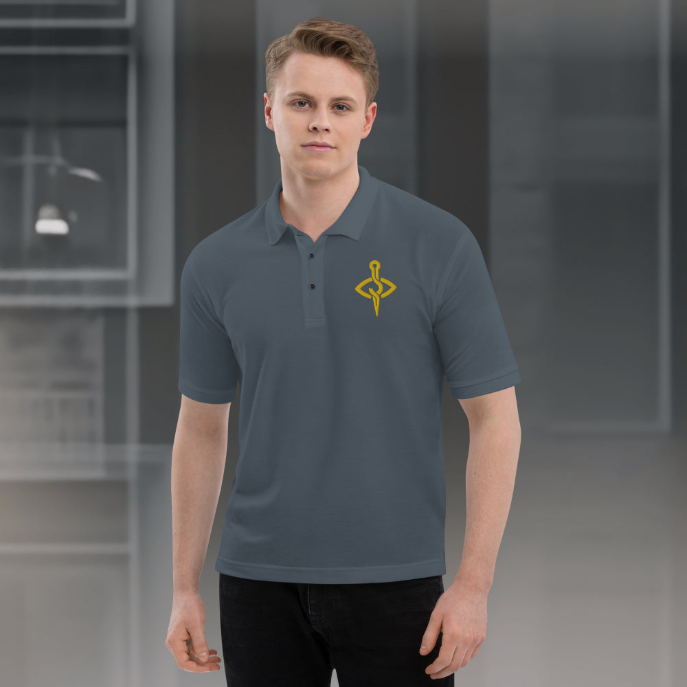 Model wearing a Stitch Art Embroidered Polo in silver with a distinctive needle and thread logo, showcasing a blend of style and craftsmanship. Front View