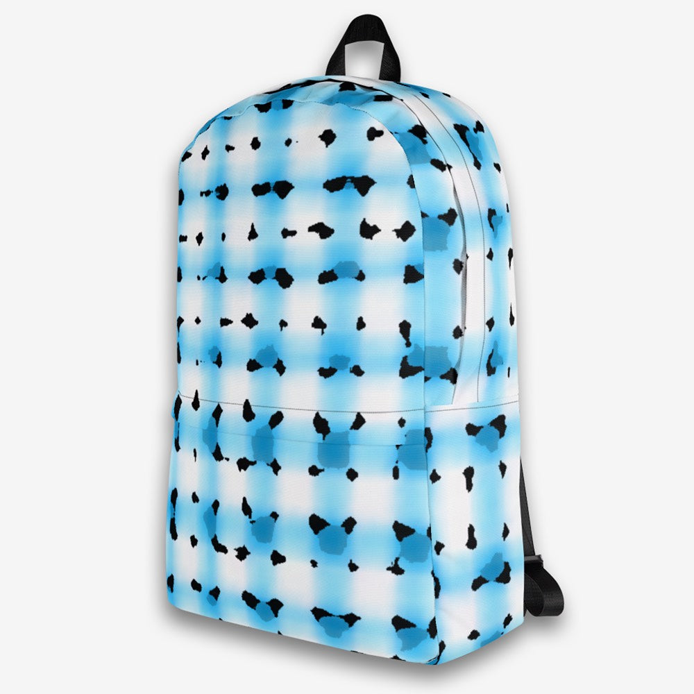 Left-side view of a modern print backpack with artistic black and blue splashes on white fabric, highlighting the side pocket and adjustable straps.