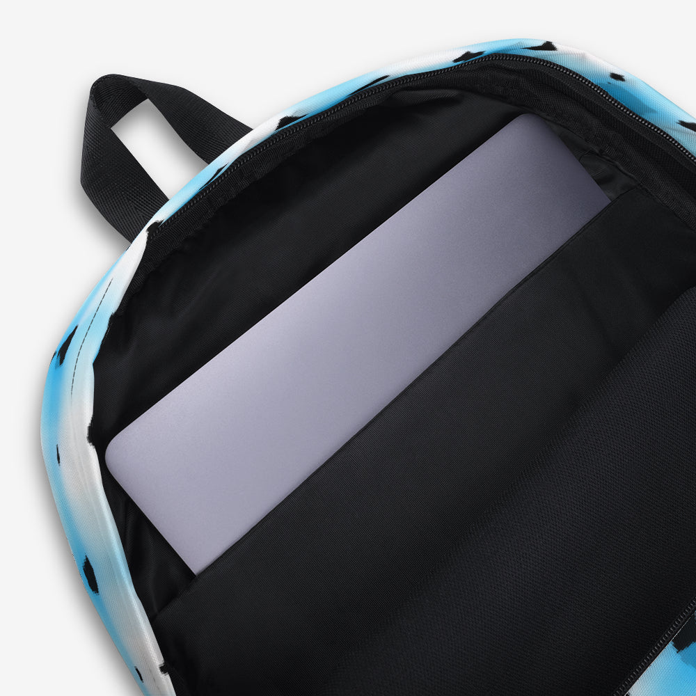 Detailed view of the backpack's spacious main compartment with a laptop sleeve, featuring a light blue interior and secure zipper closure.