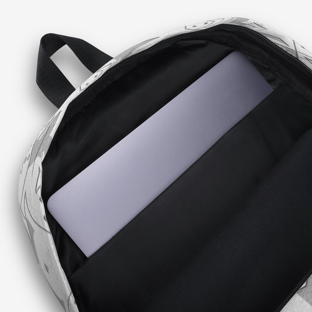 Interior view of a backpack with a black-and-white geometric pattern and a laptop sleeve.