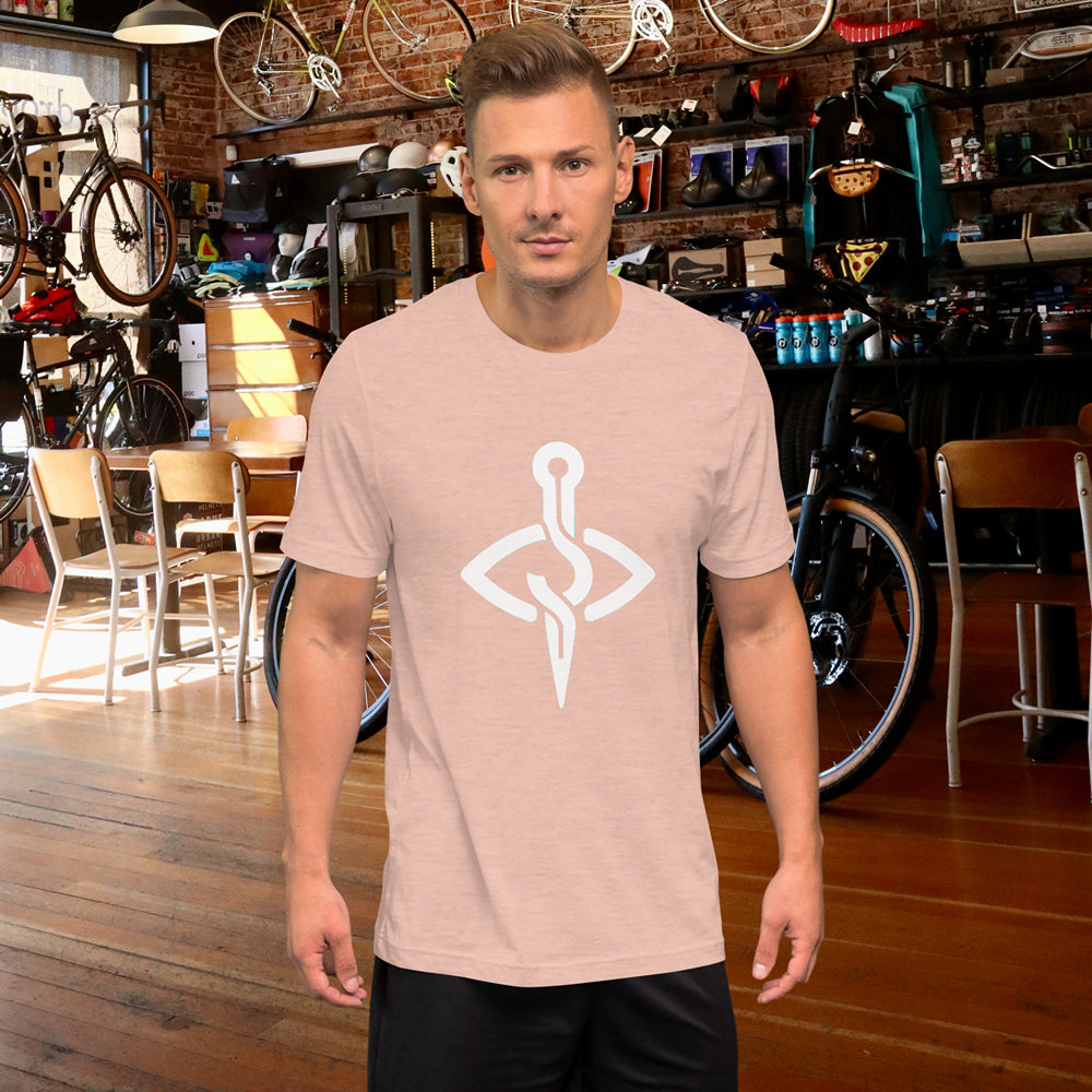 Male model posing in the Nautical Anchor Unisex Tee at a bike shop, exuding casual cool.