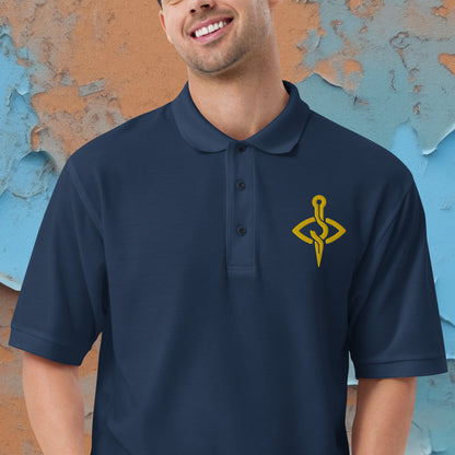 Model wearing a Stitch Art Embroidered Polo in silver with a distinctive needle and thread logo, showcasing a blend of style and craftsmanship.