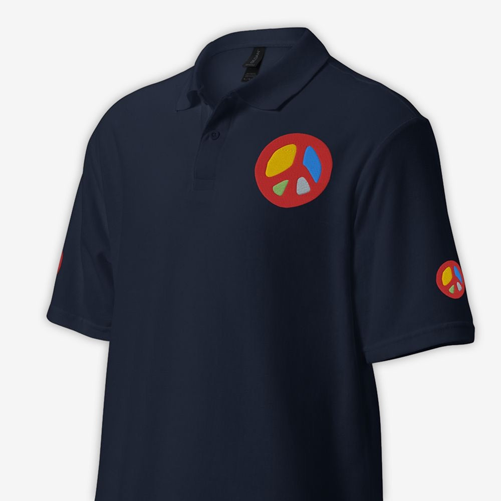 Unisex navy polo shirt with peace sign embroidery on left chest close-up