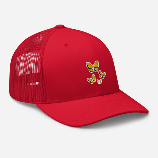 Red trucker hat with yellow butterfly embroidery, angled front view