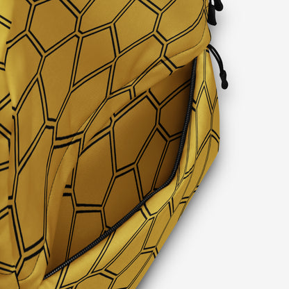 Close-up of the yellow honeycomb backpack fabric showcasing the pattern detail and stitching quality.