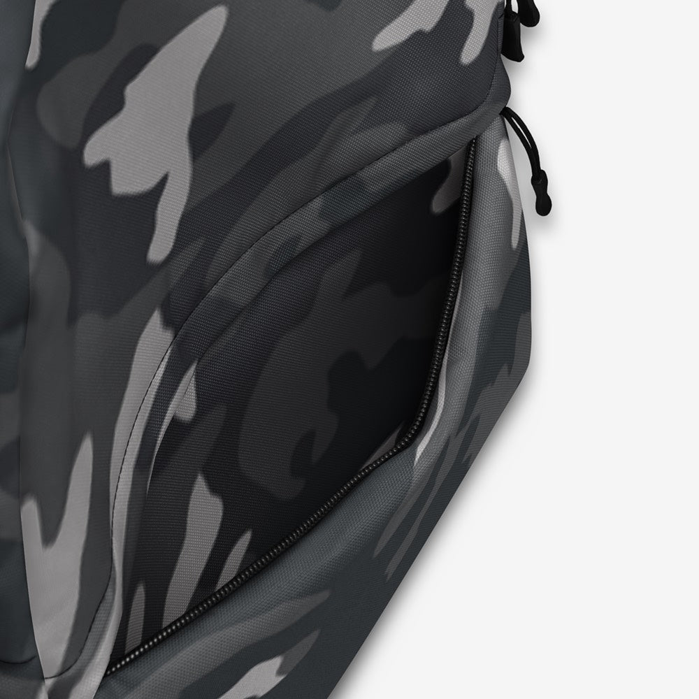 Close-up of the high-quality zipper and detailed stitching on a gray and black camouflage all-over print backpack.